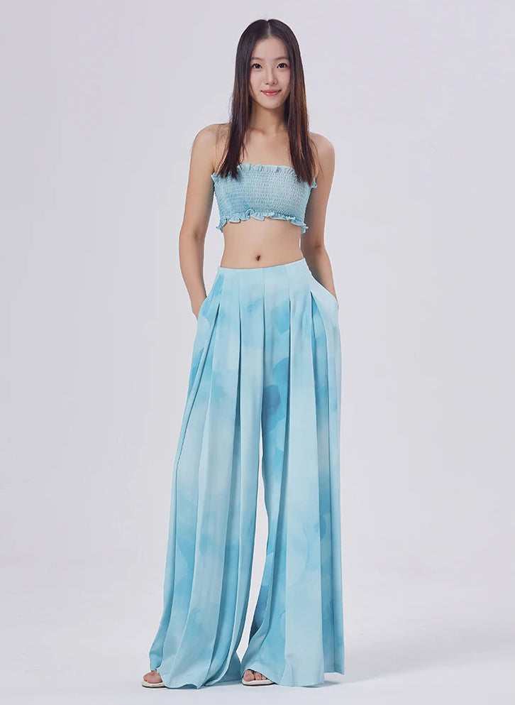 Relaxed posture revealing the deep, structural folds of silk and discrete side pockets — From Borcelleclothes.