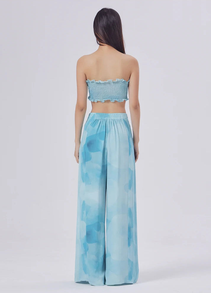 Unbroken vertical lines from waist to hem, creating the illusion of walking above the clouds — From Borcelleclothes.