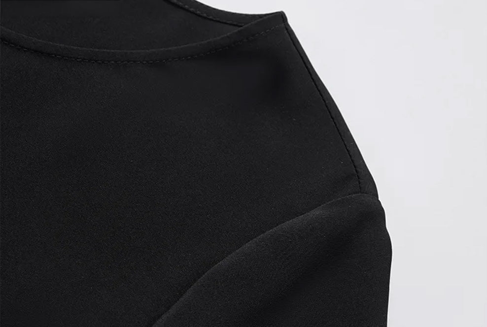 Detailed close-up of the clean shoulder seam construction and fluid drape of the 20 momme matte silk-viscose blend — From Borcelleclothes.