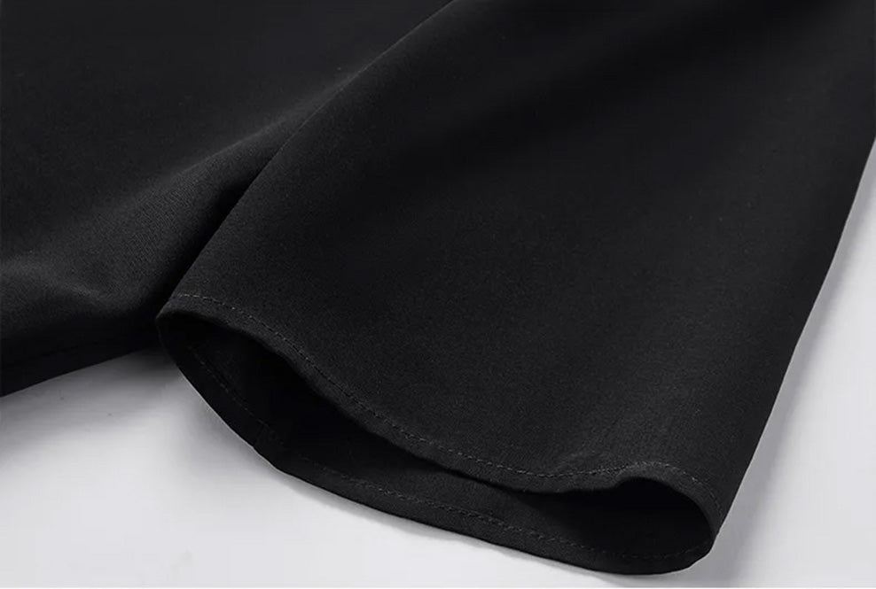 Close-up shot of the elongated set-in short sleeve, highlighting the delicate drape and finished hemline of the silk crepe top — From Borcelleclothes.