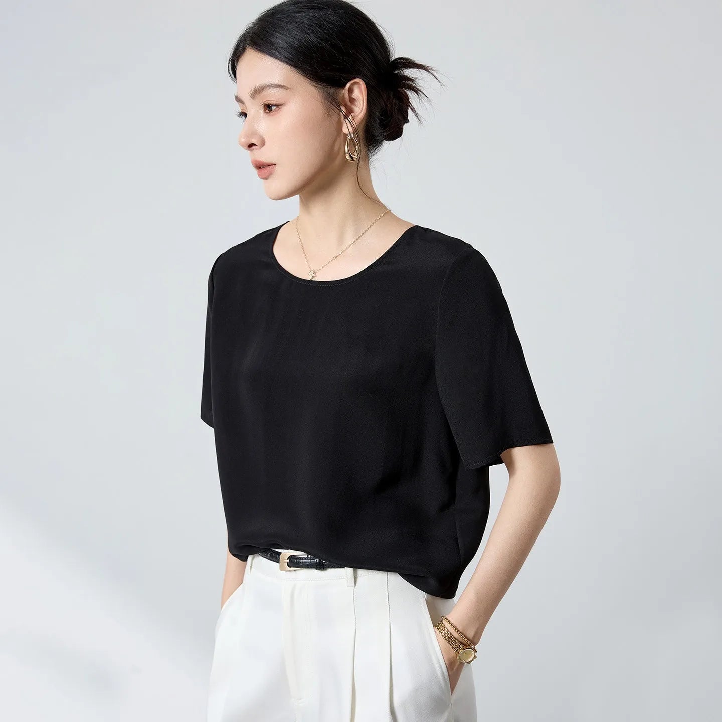 Women's Loose-fitting hip-length top in Calculated Canvas. Crafted from 20 momme matte silk crepe with a classic round neckline and elongated set-in sleeves. — From Borcelleclothes.