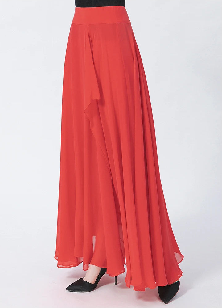 A flowing Mulberry silk georgette maxi skirt in Wild Blush, shown on a model turned slightly to the side — From Borcelleclothes.