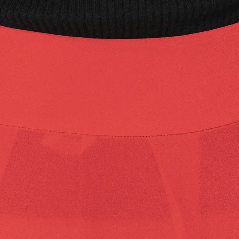 Close-up of the clean, structured back waist yoke on the Wild Blush silk georgette skirt, showing the flawless fit — From Borcelleclothes.