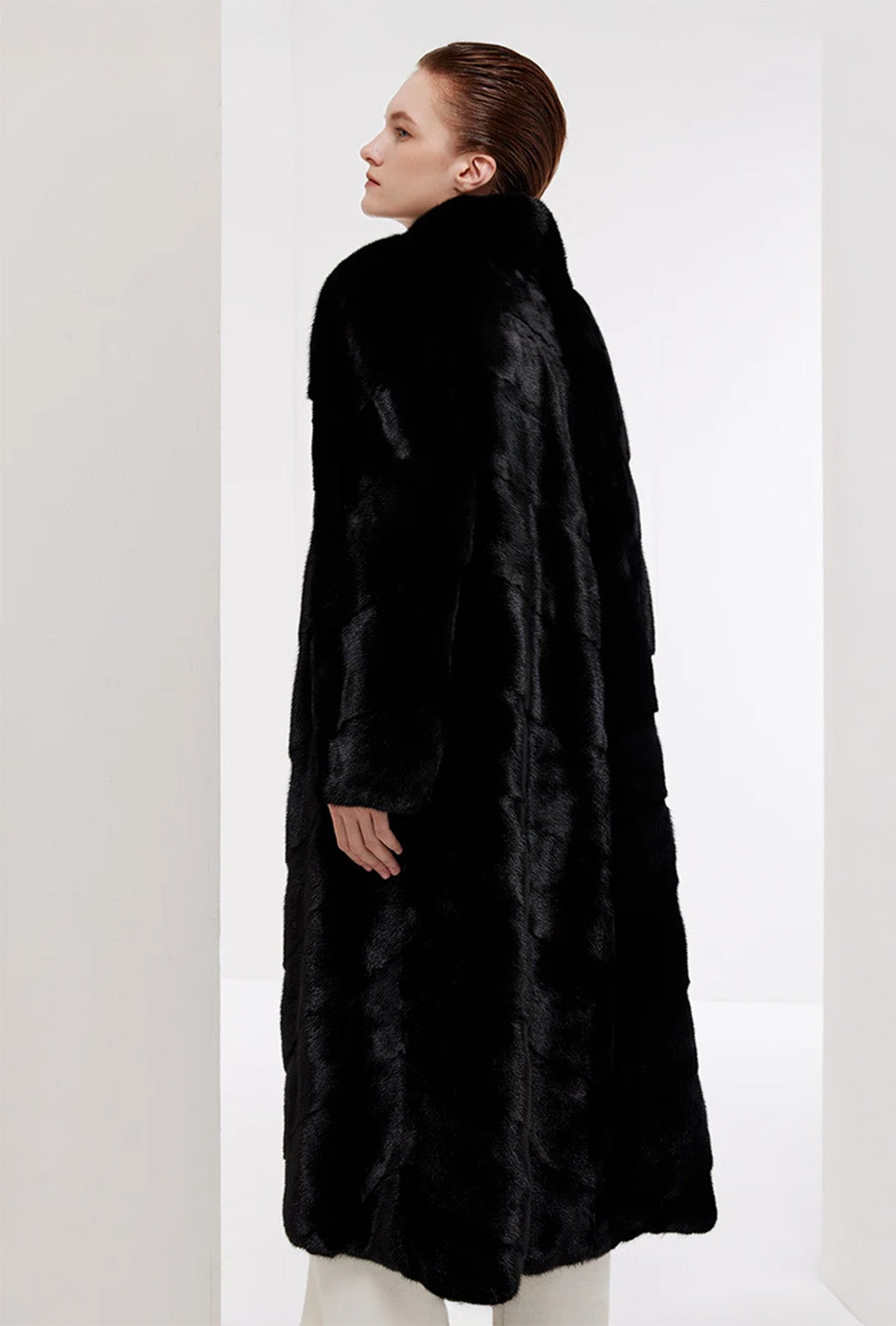 Back view of the women’s chevron sheared mink coat in Beyond Black — From Borcelleclothes.