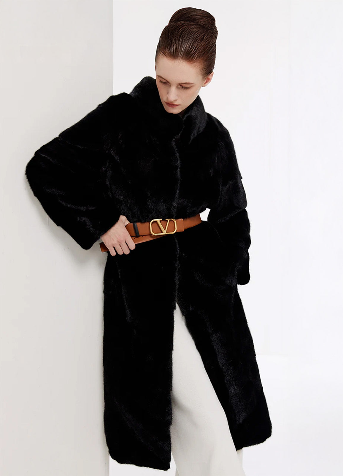 Women’s chevron sheared mink coat in Beyond Black, styled with decorative leather belt — From Borcelleclothes.