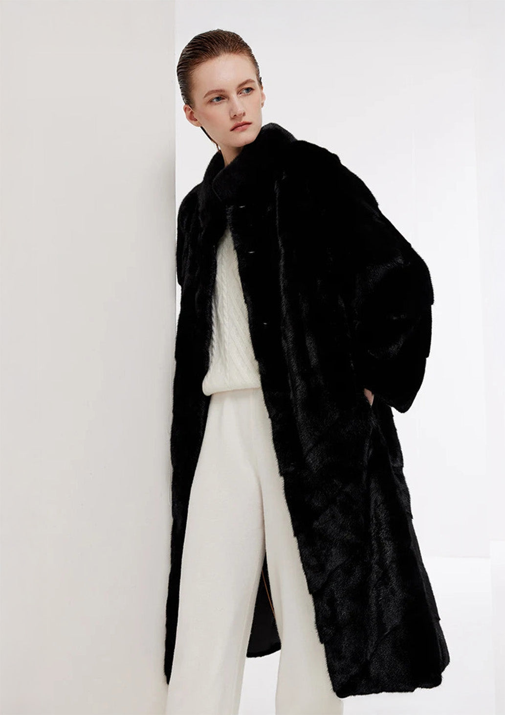 Women’s chevron sheared mink coat in Beyond Black, model with both hands in pockets — From Borcelleclothes.