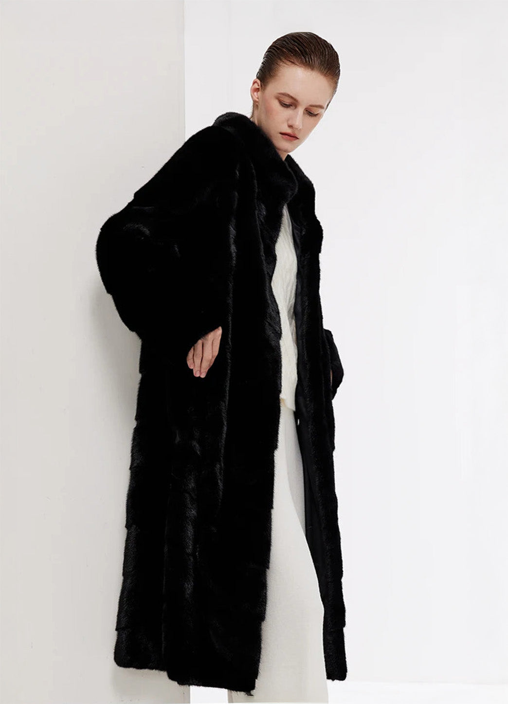 Women’s chevron sheared mink coat in Beyond Black, model putting hand in pocket — From Borcelleclothes.