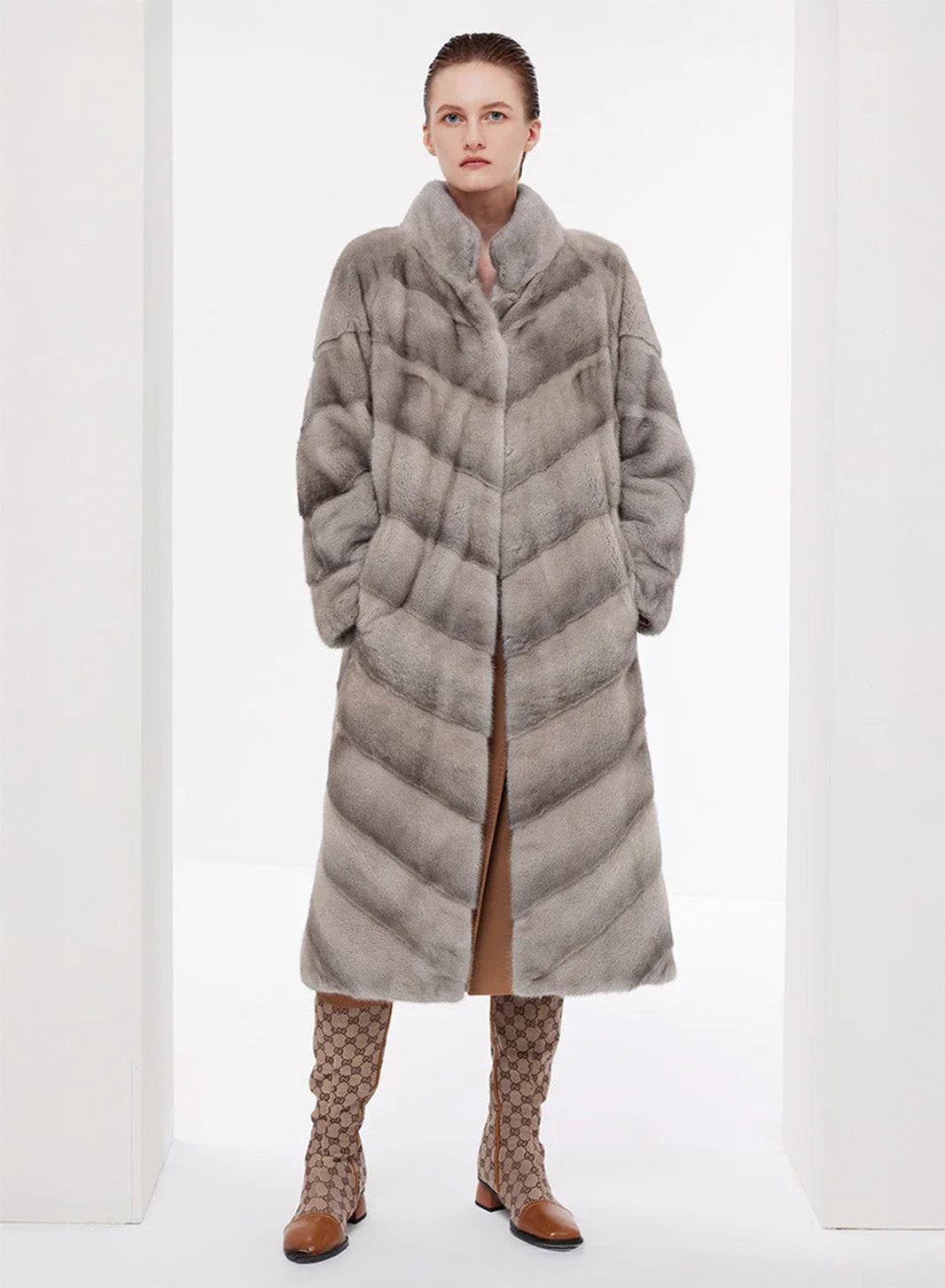 Women’s chevron sheared mink coat in Call of the Loon, model with hands in side pockets — From Borcelleclothes.