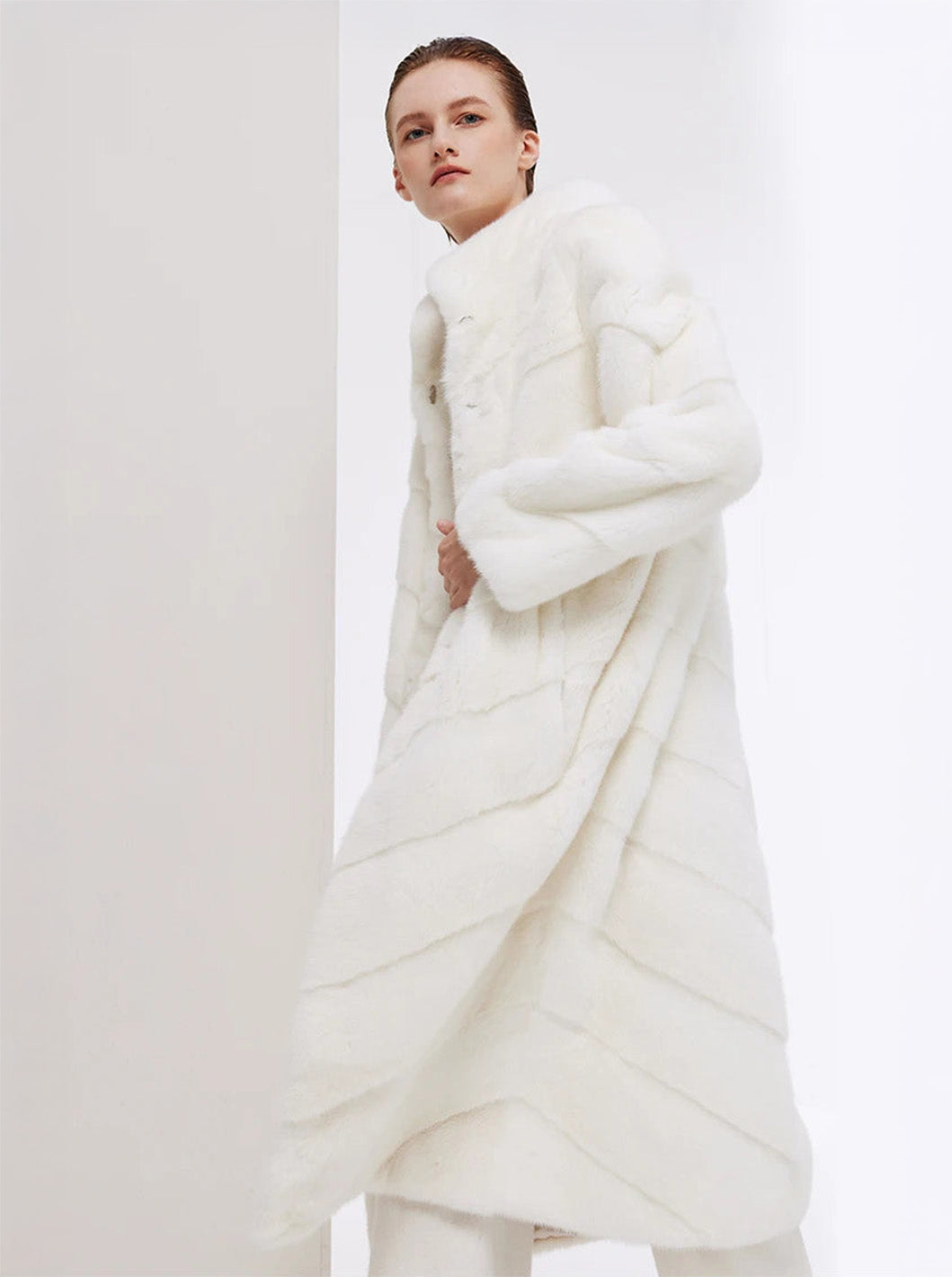 Women’s chevron sheared mink coat in Calm, model in motion — From Borcelleclothes.