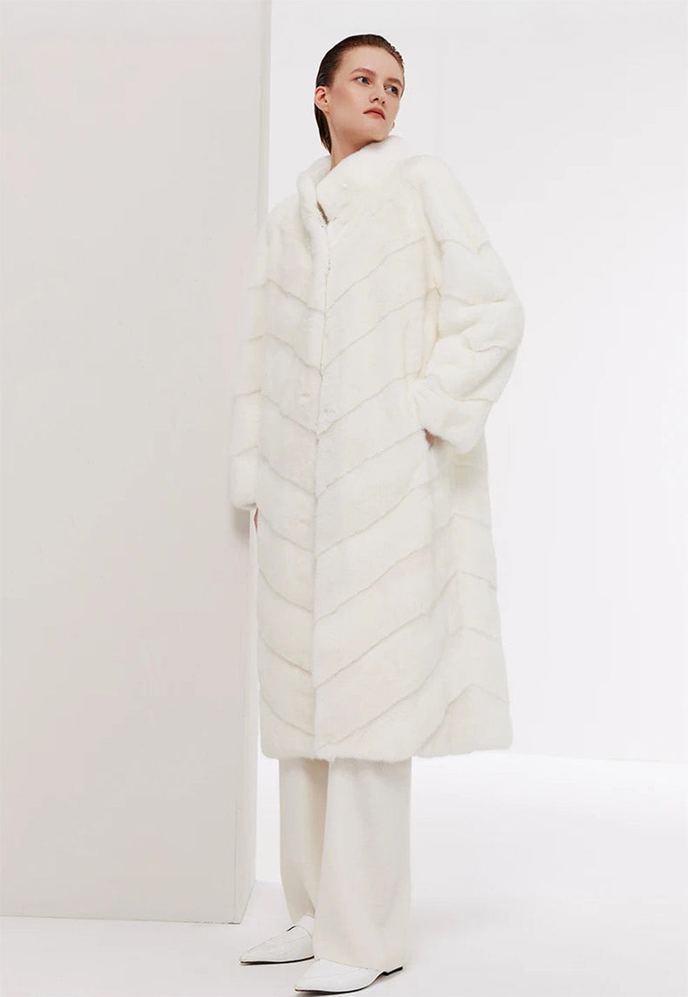 Women’s chevron sheared mink coat in Calm, model with hand in pocket — From Borcelleclothes.