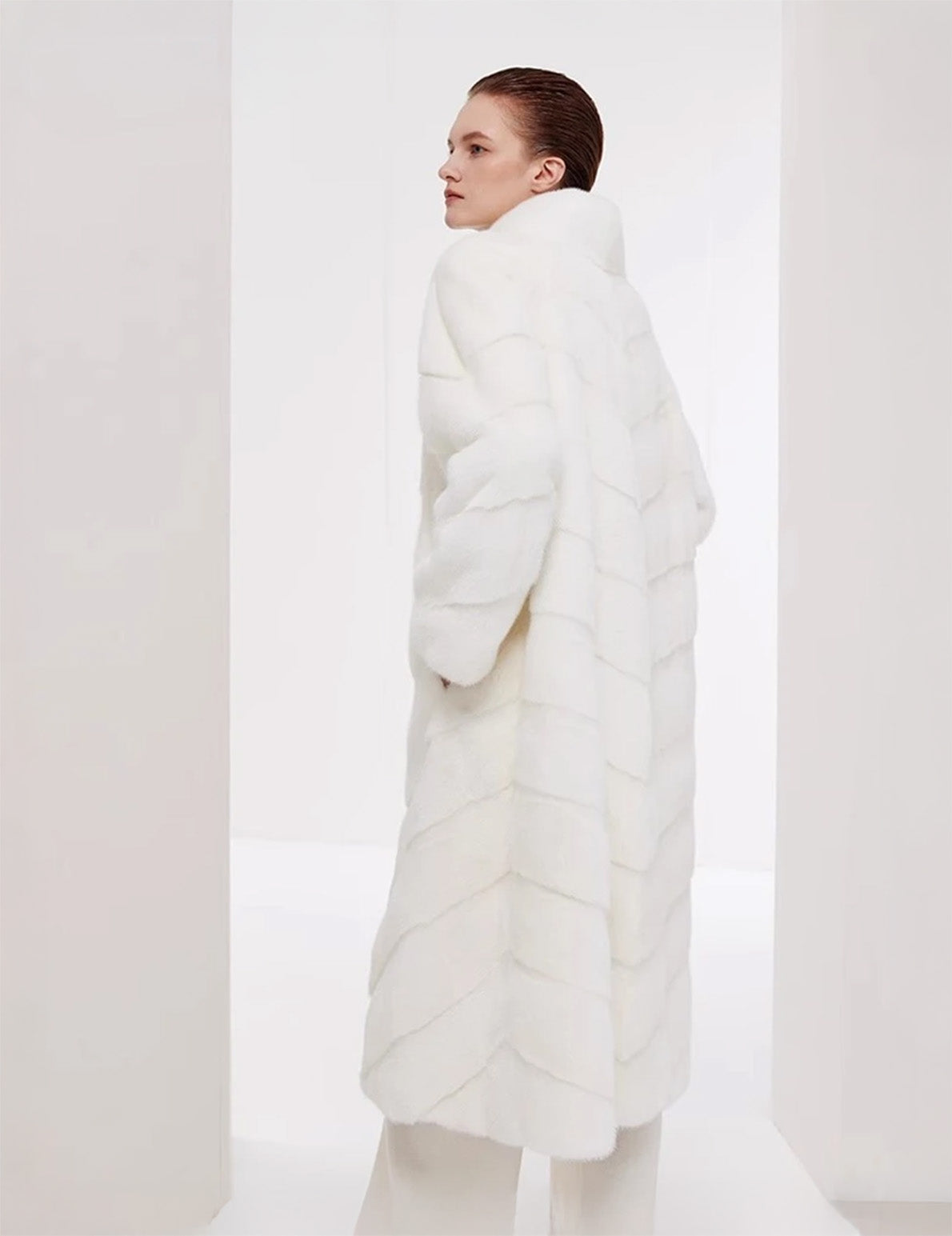 Side view of the women’s chevron sheared mink coat in Calm — From Borcelleclothes.