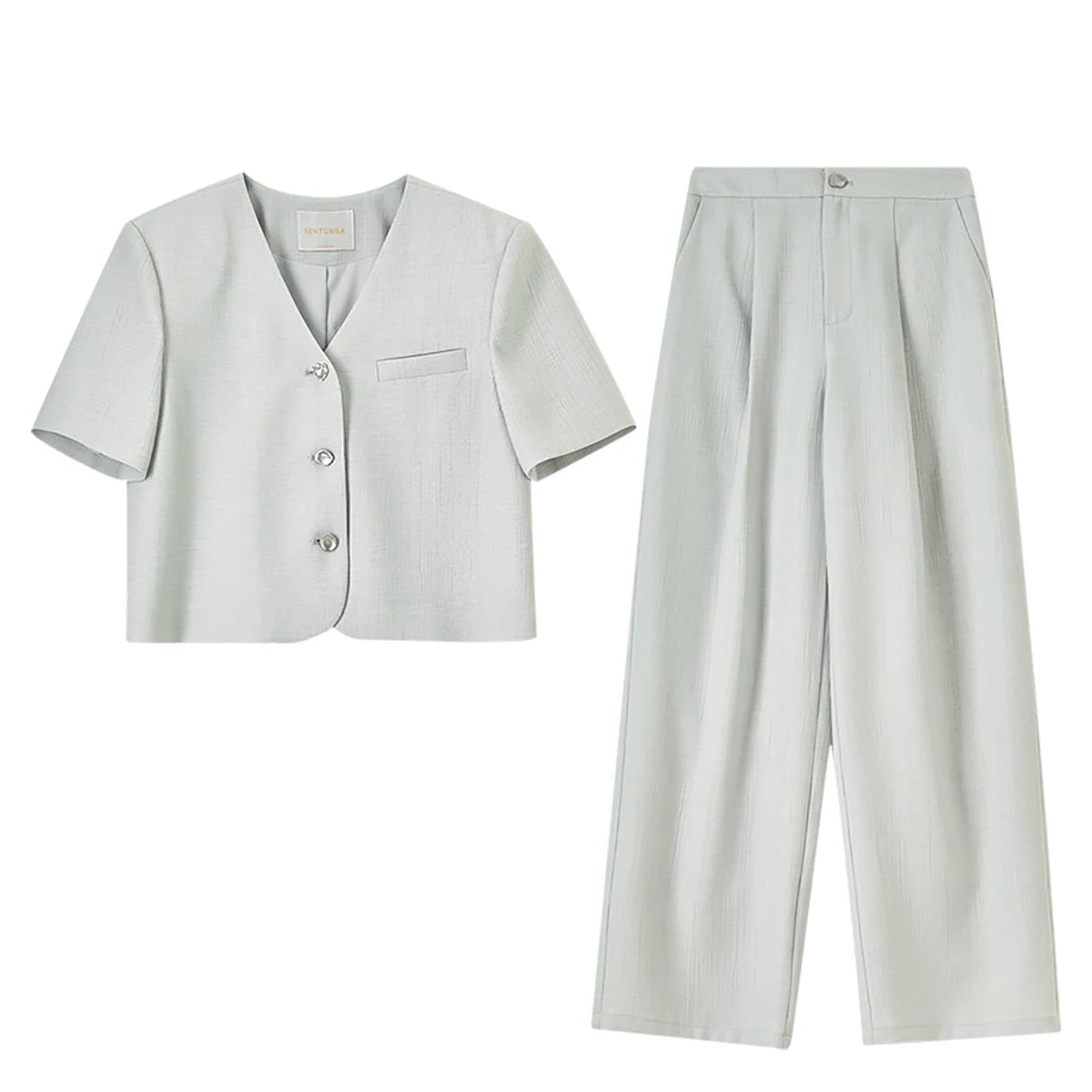 Flat lay of the Clean Geometry viscose set including the cropped jacket and pleated wide-leg trousers. From Borcelleclothes.