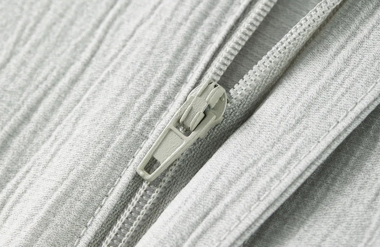 Detail of the trousers featuring an unzipped zipper fly, showing the high-quality construction of the Named by Frost set. From Borcelleclothes.
