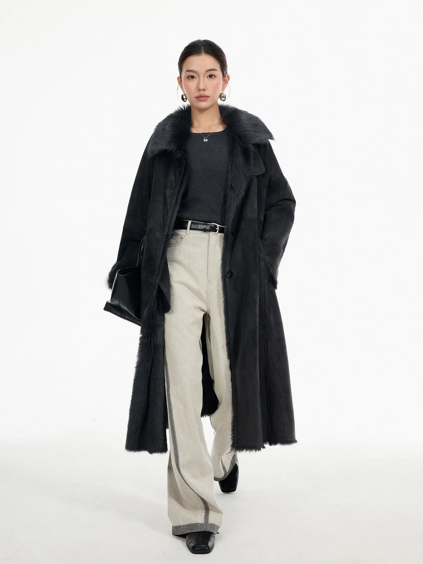 Women's Convertible collar goatskin coat in Tusch color with a straight silhouette, leather-bound buttonholes, and visible interior fur accents — From Borcelleclothes.