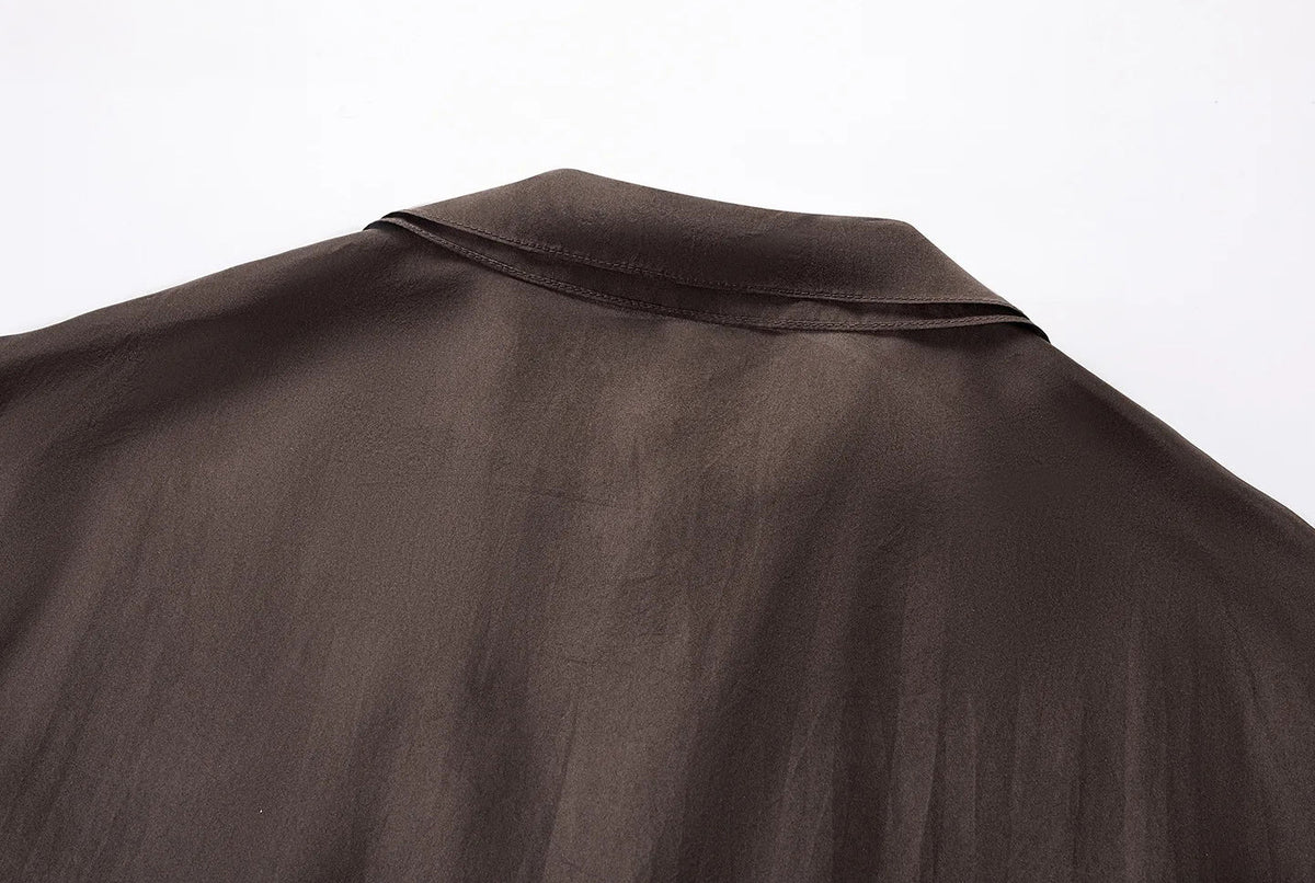 Back view construction detail of convertible silk blouson collar — From Borcelleclothes.