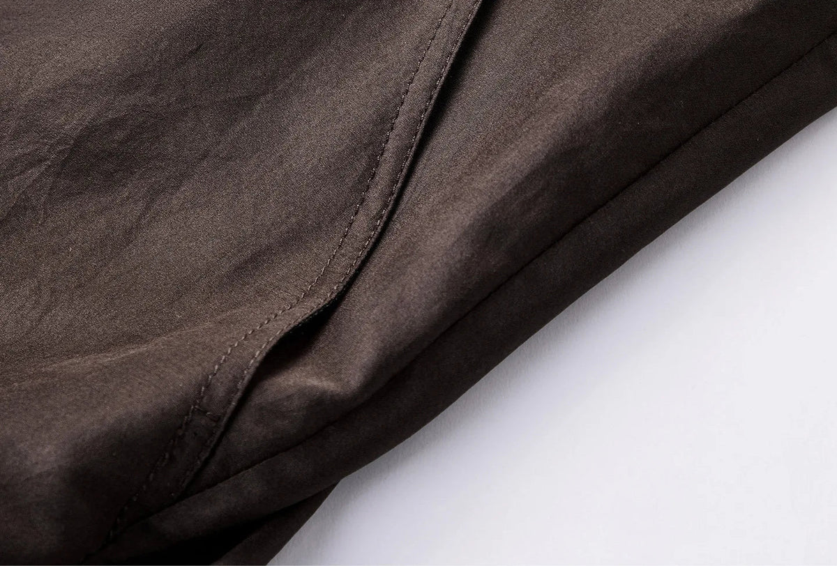 Detail view of side slash pocket on Habotai Mulberry silk blouson — From Borcelleclothes.