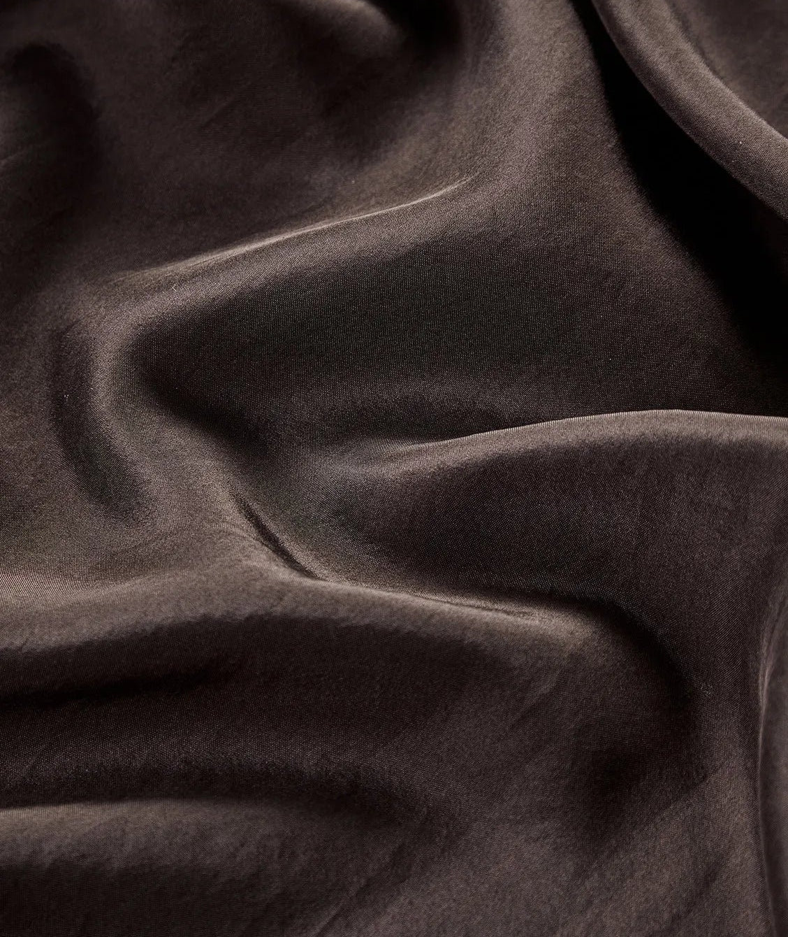 Close-up of wave-folded texture on 100% Habotai Mulberry silk in Bitter Chocolate — From Borcelleclothes.