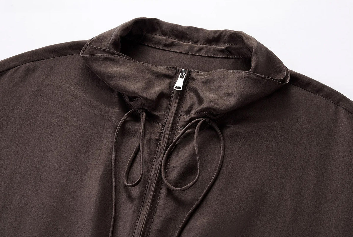 Front detail of zipped double-layer convertible stand collar on silk blouson — From Borcelleclothes.
