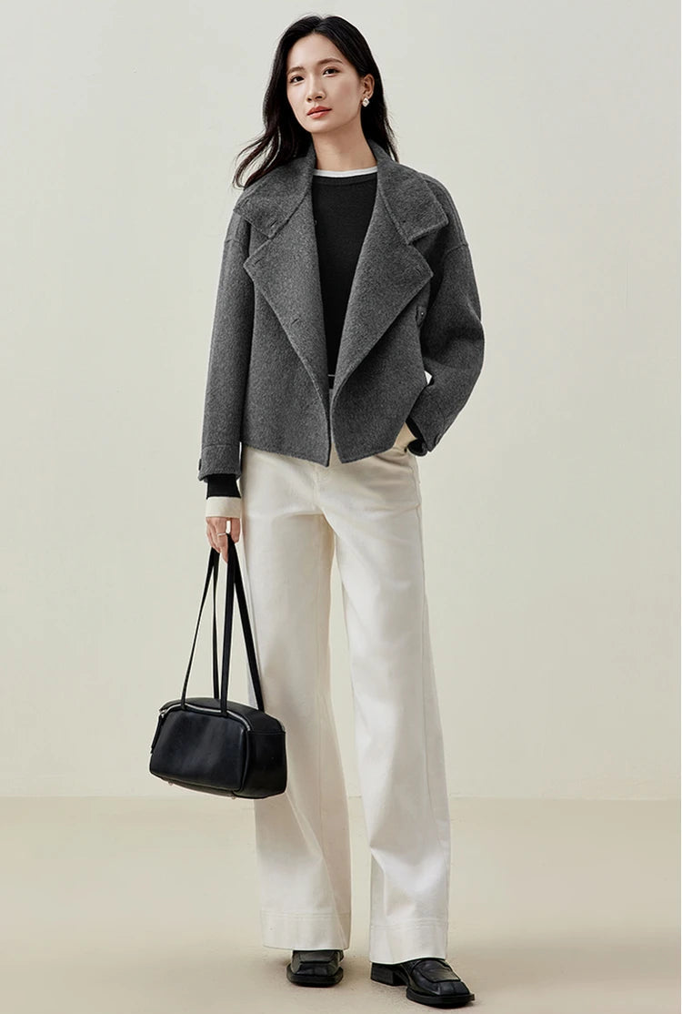 The ultimate Equilibrium — a woman experiencing the soft transition of the cascading Notch Lapels. — From Borcelleclothes.