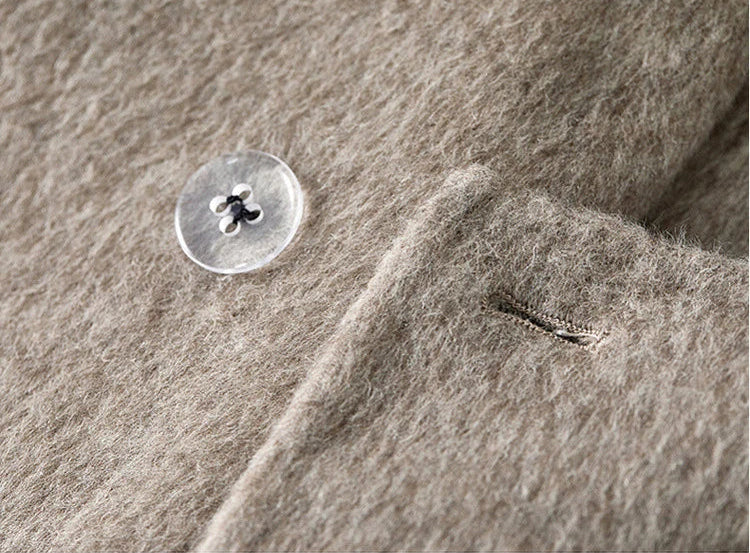The hidden sign of quality — a discrete transparent backer button ensuring the durability of the heavy wool. — From Borcelleclothes.