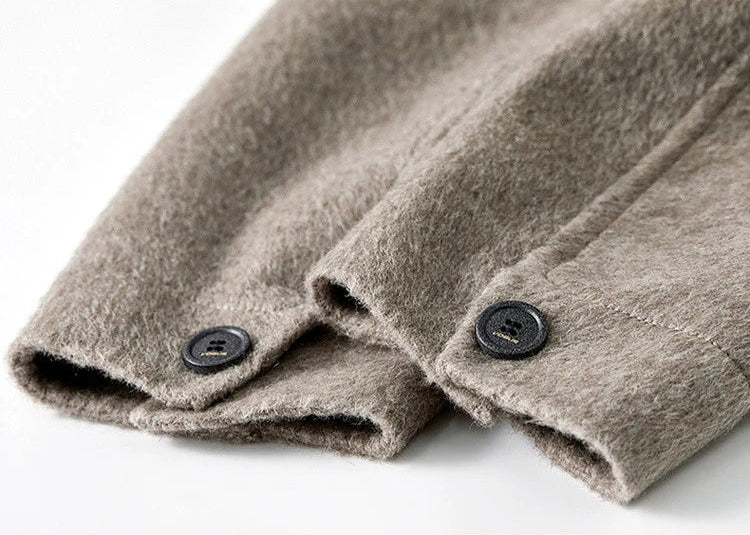 Detailed view of the precisely finished cuffs, reflecting the hand-finished craftsmanship of Borcelle. — From Borcelleclothes.