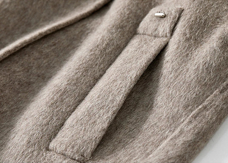 Close-up of the clean, single-welt side pocket, integrated seamlessly into the jacket's structure. — From Borcelleclothes.