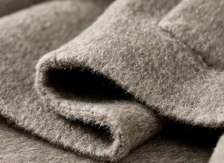 The heavy, unlined hem of the jacket creating a natural "wave" as it yields to gravity. — From Borcelleclothes.