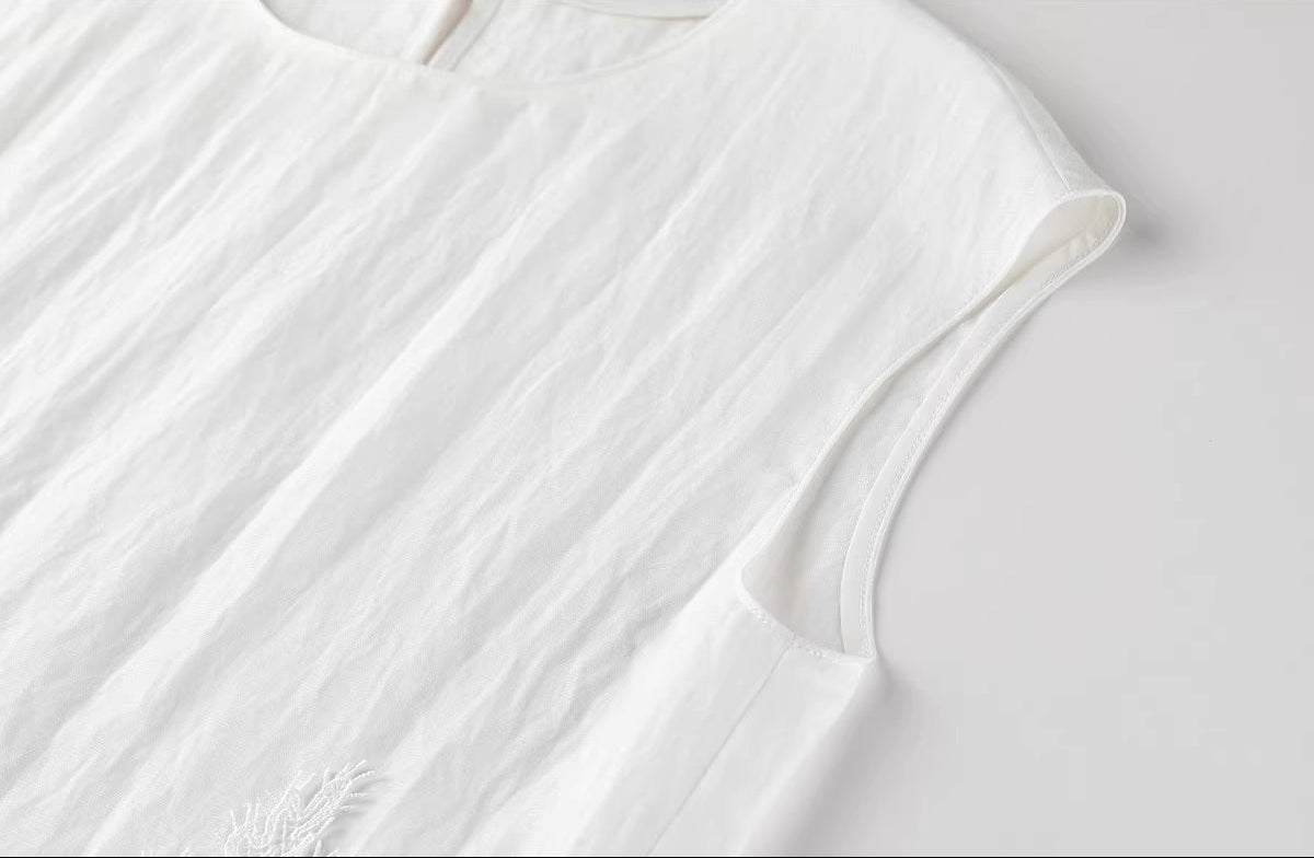 Detail shot of the sleeveless armhole finishing on the Foam Kiss linen top. — From Borcelleclothes.