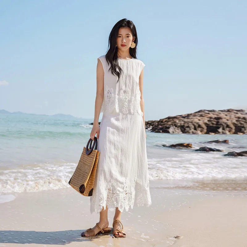 Women's two-piece set featuring a cropped sleeveless top with a pearl button closure and a mid-calf A-line skirt. — From Borcelleclothes.