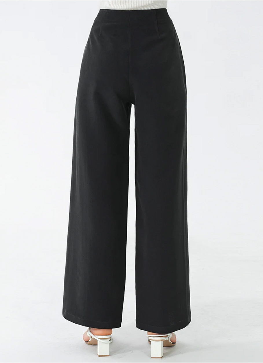 Back view of Couture Noir Mulberry silk wide-leg trousers showing tailored back darts and fit — From Borcelleclothes.