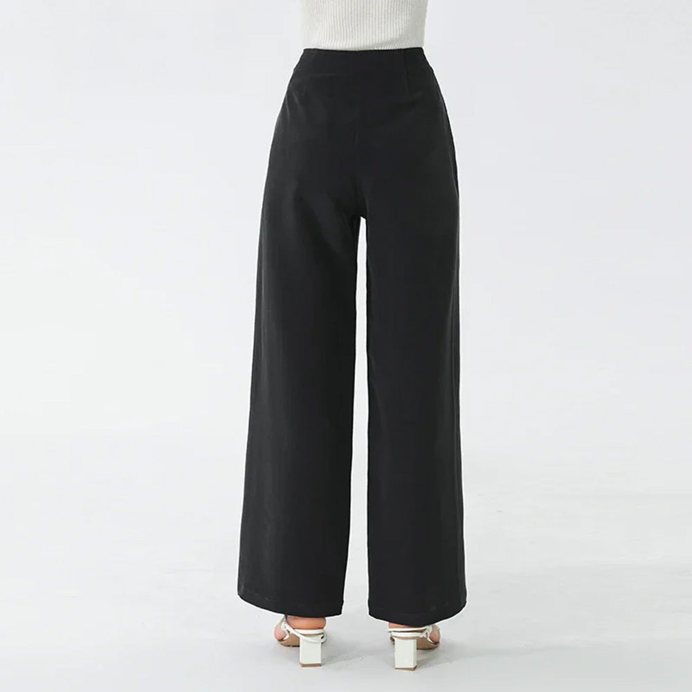 Back view of model with raised arms displaying the fluid drape and floor-length silhouette — From Borcelleclothes.