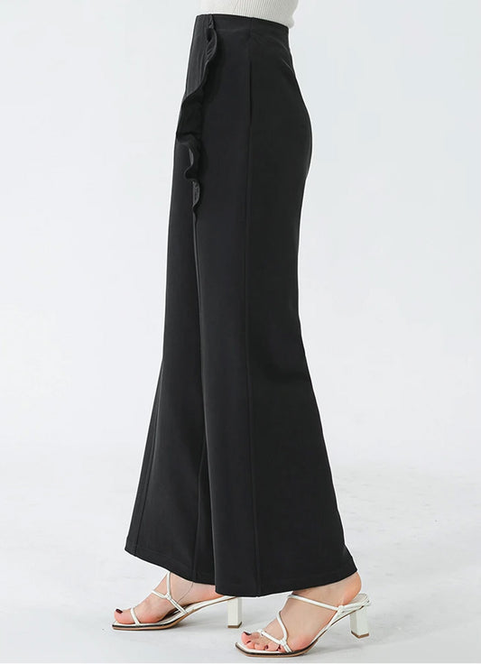 Profile view of women's wide-leg Mulberry silk trousers in Couture Noir — From Borcelleclothes.
