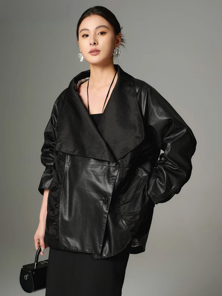 Model front view, highlighting the substantial cowhide grain of the Beneath the Mask jacket with the unfastened collar showing the generous lapels. — From Borcelleclothes.