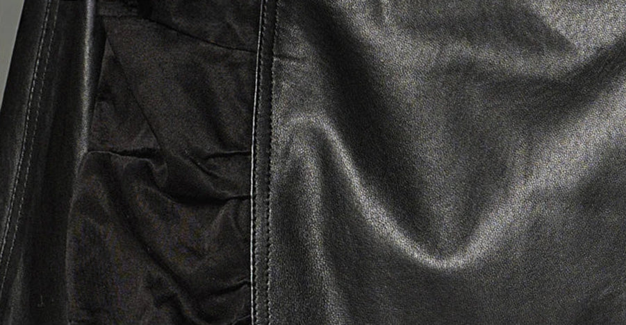 A detailed close-up of the architectural back panels, where a deep, padded central wedge creates sculptural volume below the waist. — From Borcelleclothes.