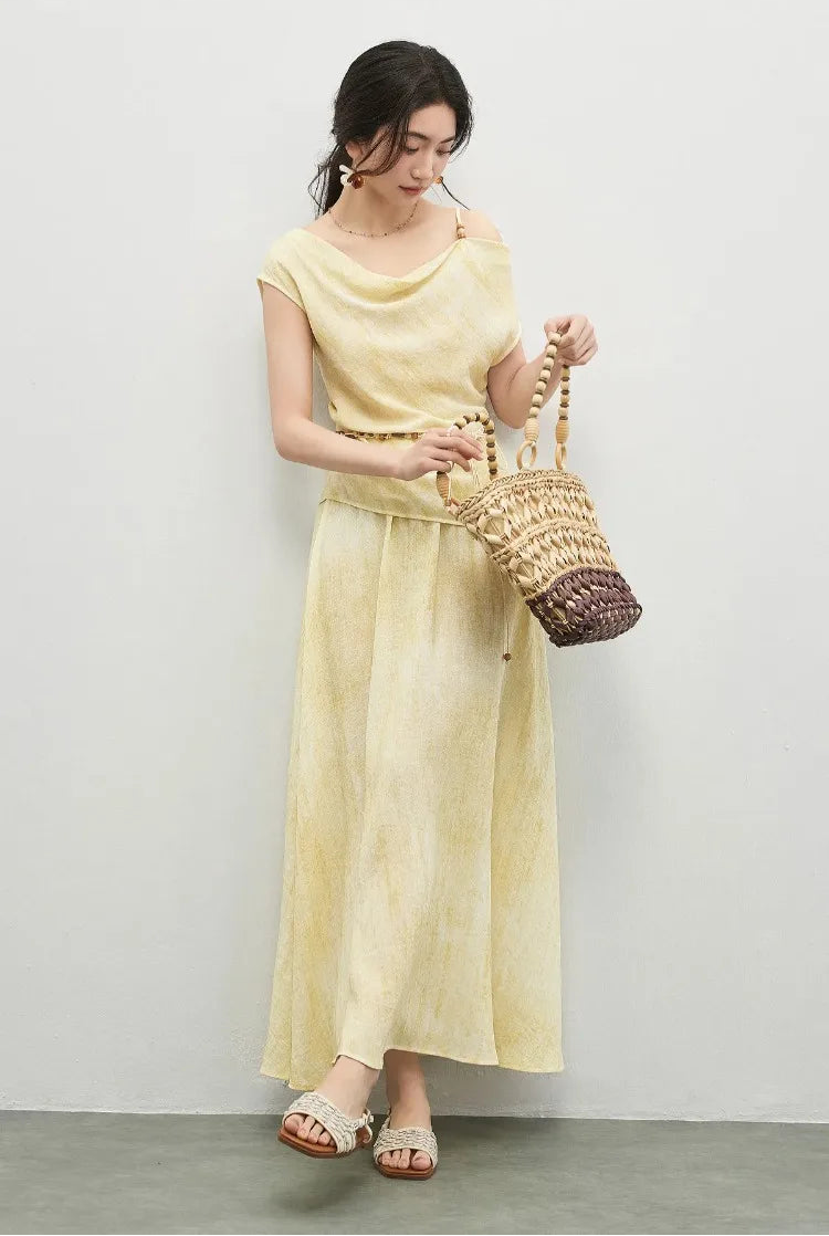 A woman captured in motion while opening her woven bag, showing the effortless urban style of the set — From Borcelleclothes.