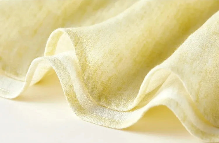 Close-up of the clean, flowing hemline of the mid-calf viscose skirt — From Borcelleclothes.