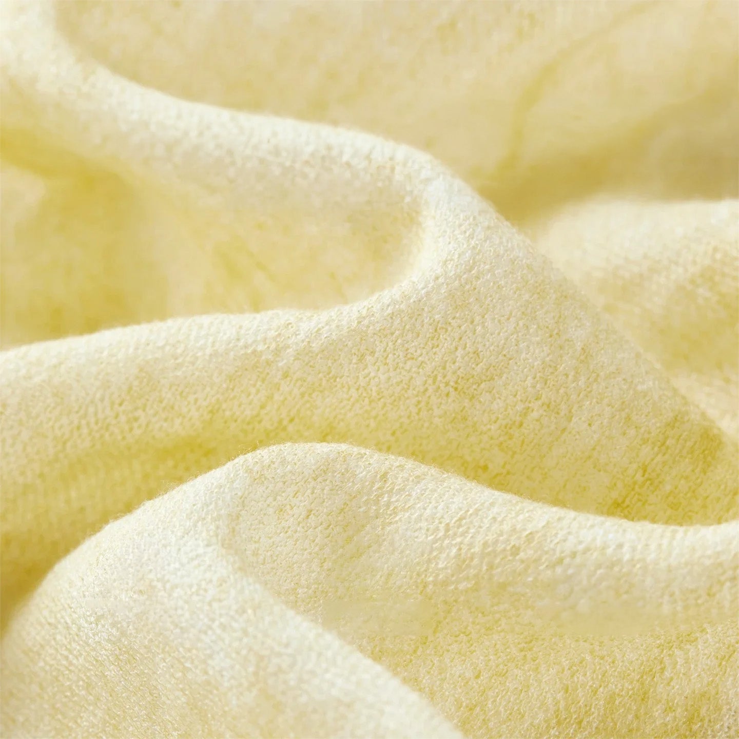 A close-up of the wave-like folded texture of the Urban Hippolita fabric, showing the subtle olive gradient — From Borcelleclothes.