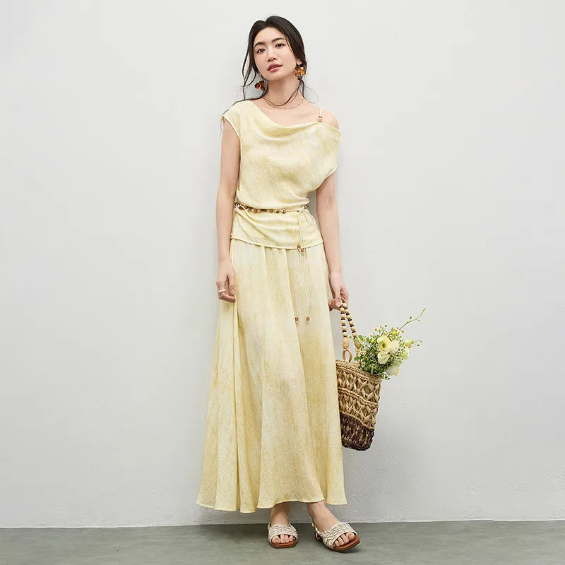 Women's Urban Hippolita set: golden viscose top with beaded shoulder strap and cowl neck, asymmetrical hem, and flared midi skirt with decorative beaded belt.
