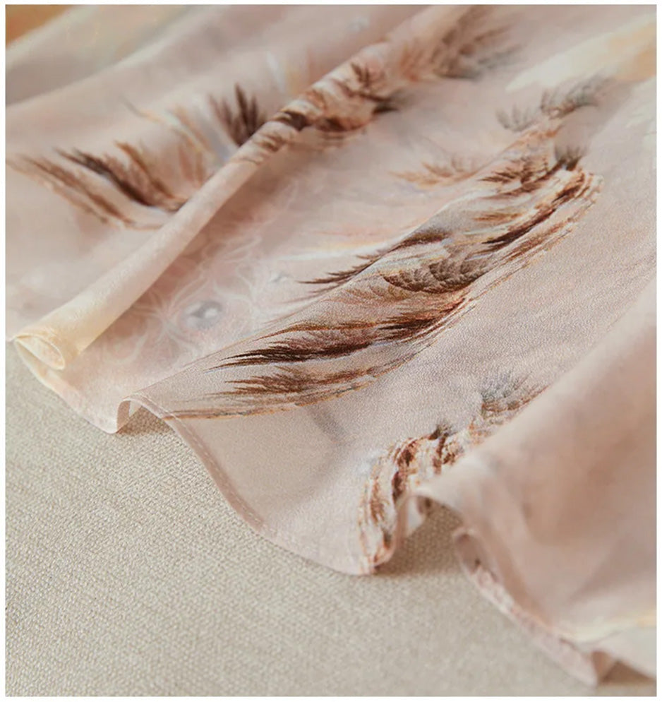 Focus on the asymmetrical bottom hem, where cascading silk flounces create a sense of weightless, natural volume — From Borcelleclothes.