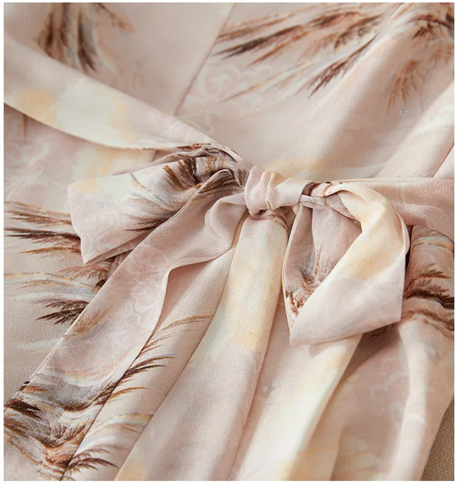 A close-up of the defined waistline featuring a self-tied silk sash, adding a touch of soft, adjustable elegance — From Borcelleclothes.
