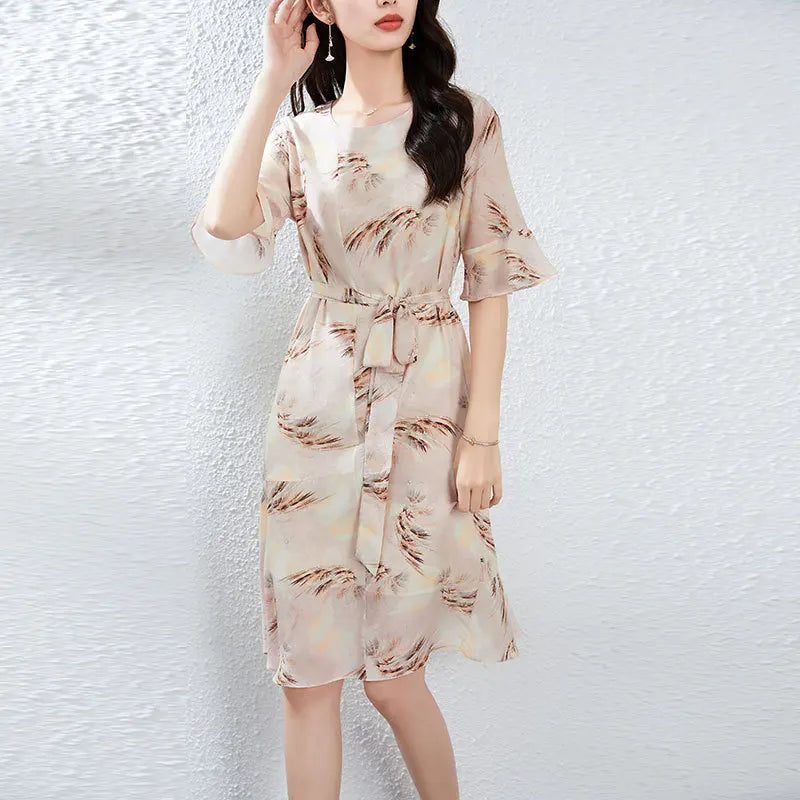 Women's 100% Mulberry silk dress in First Light color with asymmetrical flounce details and fluttering sleeves. — From Borcelleclothes.