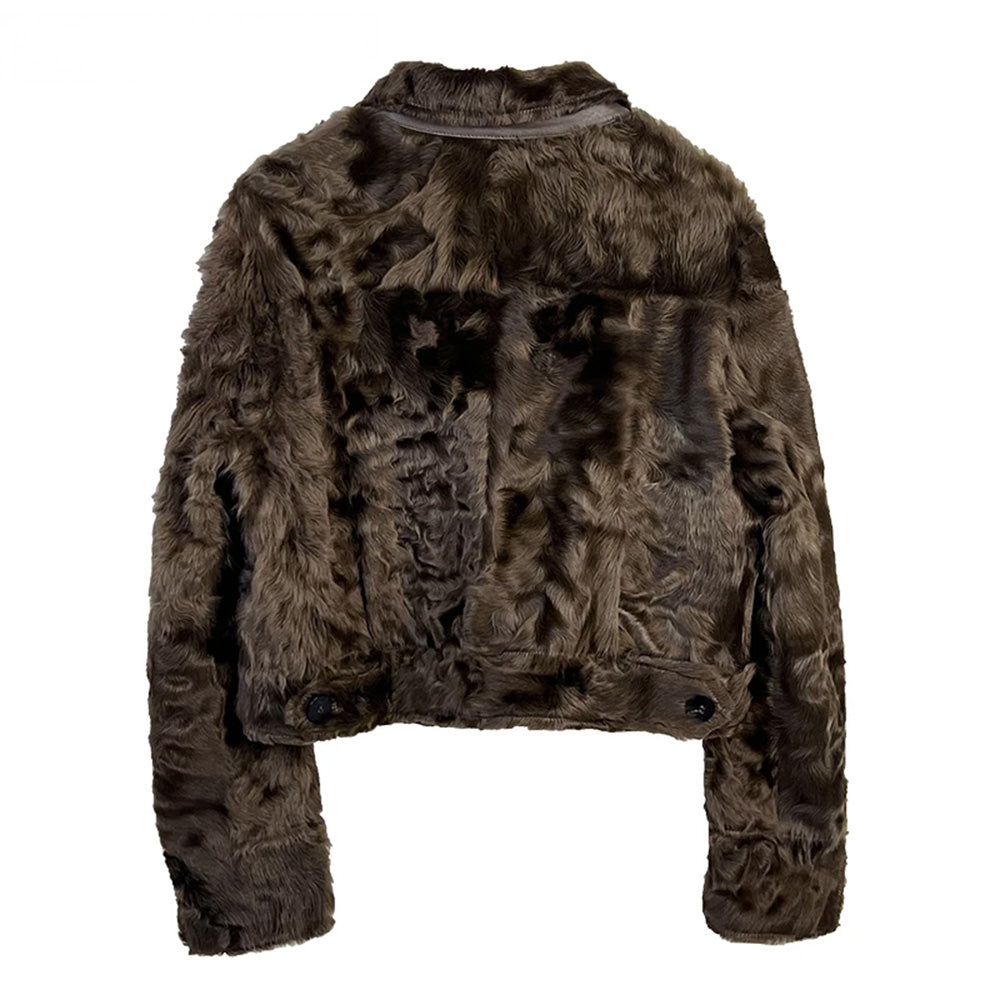 The back view of the Star Anise shearling jacket, displaying the seamless texture and the warm, golden-brown undertones of the fine-wool sheepskin. — From Borcelleclothes.