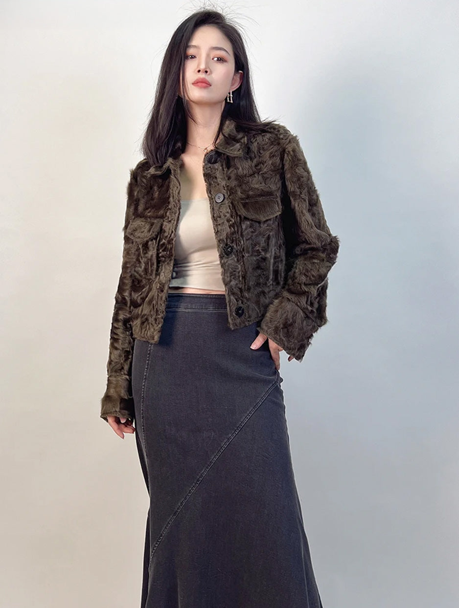 A confident stance in the Star Anise shearling jacket, where military-inspired shoulder tabs meet a feminine, cropped silhouette. — From Borcelleclothes.