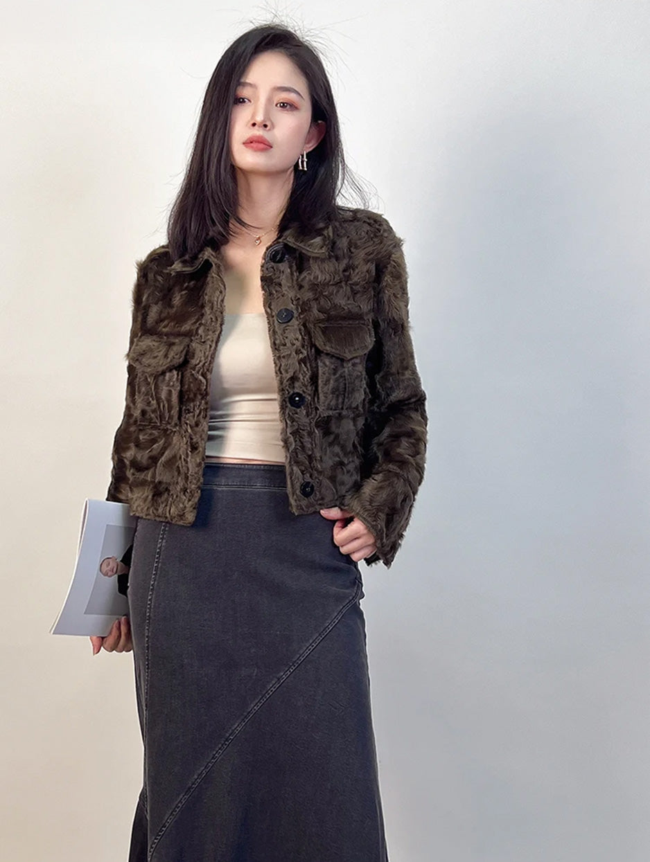 The architectural silhouette of the Star Anise jacket paired with a journal, capturing a quiet moment of reflection. — From Borcelleclothes.