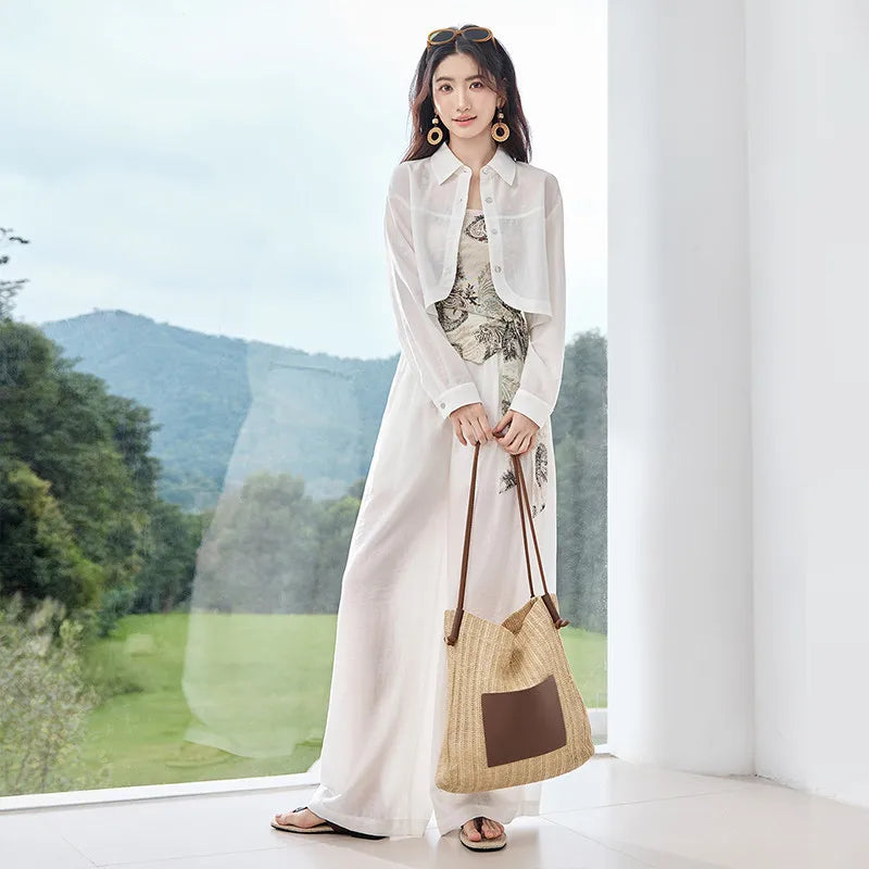 Three-piece set in Alabaster Mirage. Noble lyocell and linen blend. Cropped shirt with rounded hem, draped wrap top with Cashew Flower texture, and wide-leg trousers. — From Borcelleclothes.