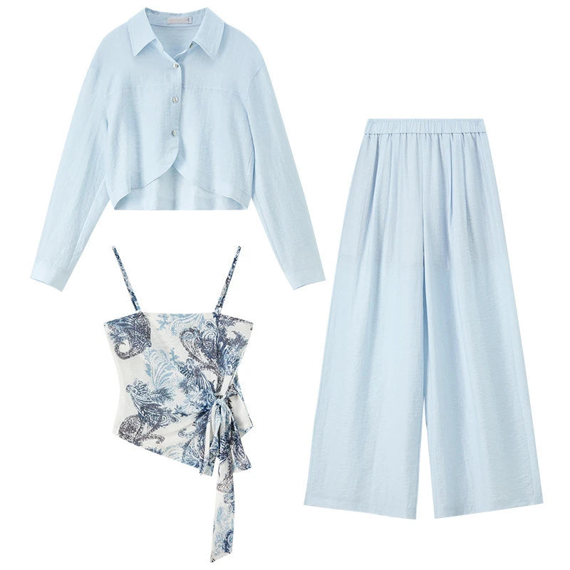 Flat lay of the Lapis Shimmer three-piece set, showing the shirt, trousers, and top in a single composition. From Borcelleclothes.