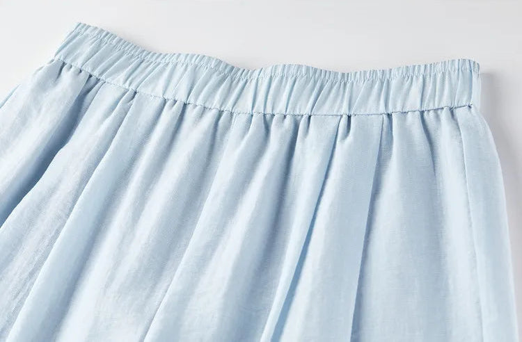 Detail of the elasticated waistband on the Lapis Shimmer trousers for a comfortable, grounded fit. From Borcelleclothes.