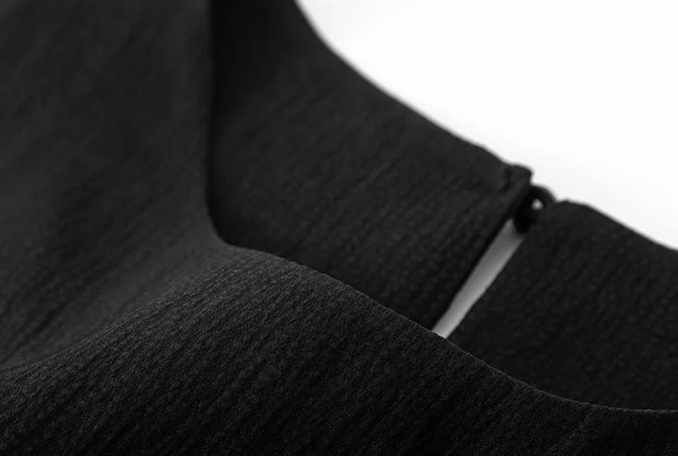 Front neckline detail of the women's defined waist mulberry silk blouse in Queen of Spades — From Borcelleclothes.