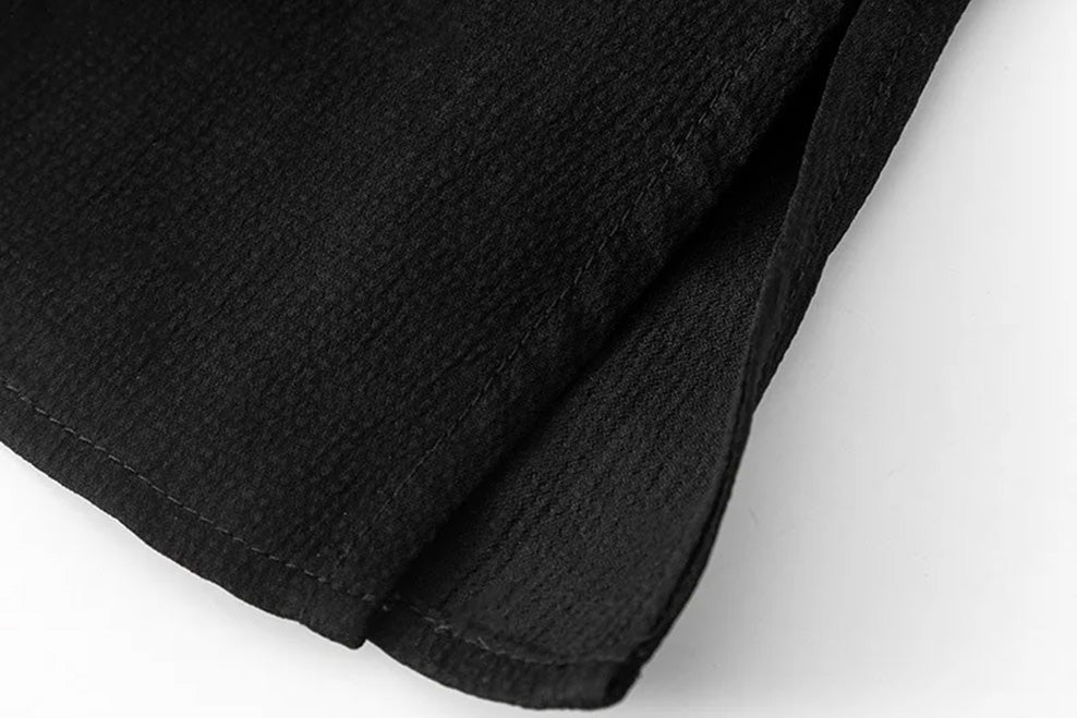 Side hem slit detail of the defined waist mulberry silk blouse in Queen of Spades — From Borcelleclothes.