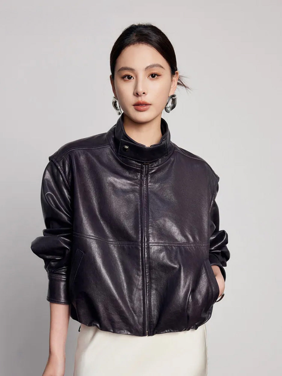 Front angle of the waxed sheepskin jacket with a hand in the single-welt side pocket — From Borcelleclothes.